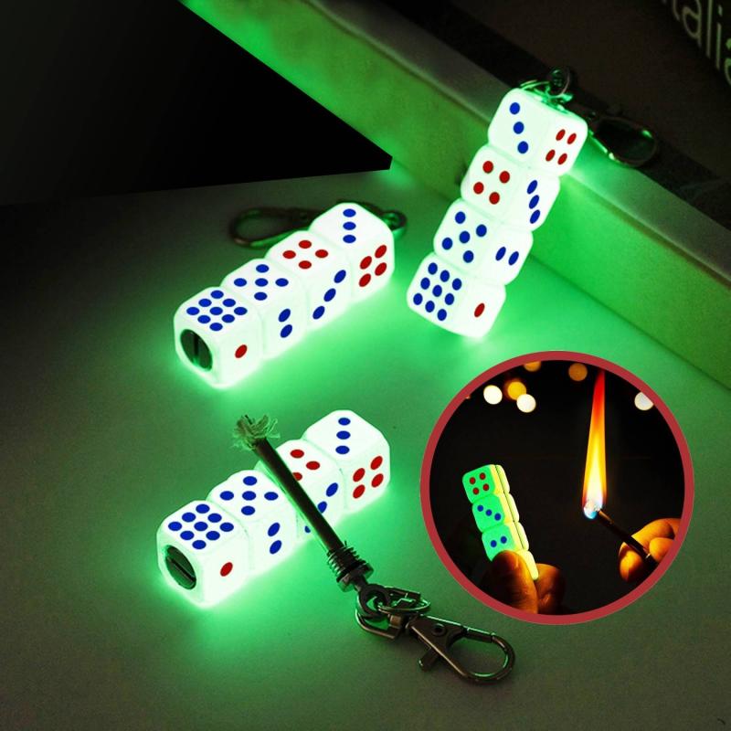 Bật lửa hình hột xí ngầu có móc khoá diêm xăng (dạ quang hút ánh sáng)